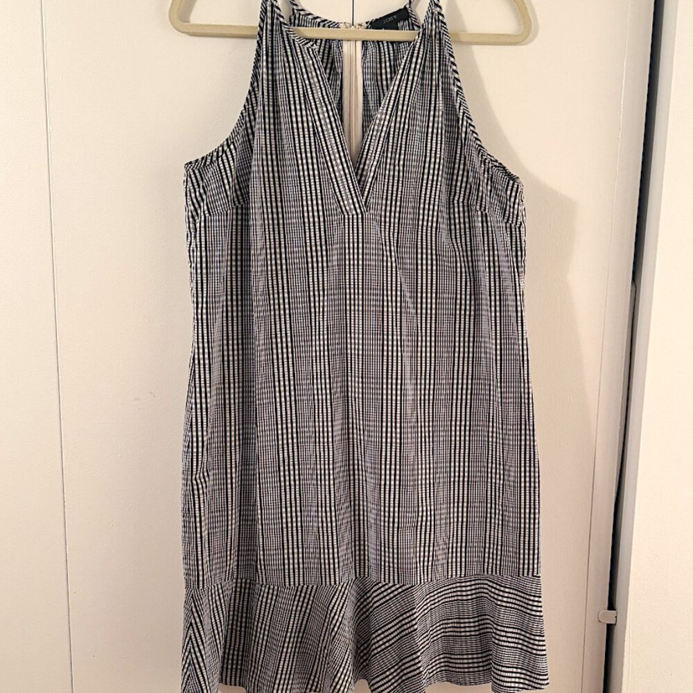 J Crew strapy check short dress with bottom ruffle and low cut V in front.
